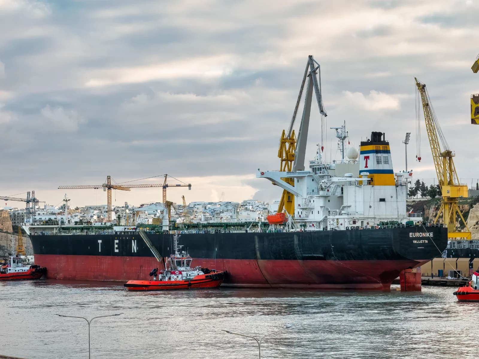 Container cranes at a busy port